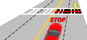 Diagram of a red car approaching a crosswalk where a yellow pedestrian figure is crossing, with the word STOP in bold letters in front of the car.